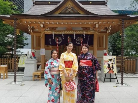 High school students in kimonos outside temple in Japan