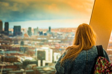 Redheaded student looking at London skyline