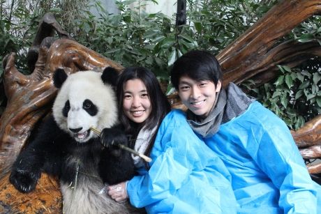 Students posing with a panda