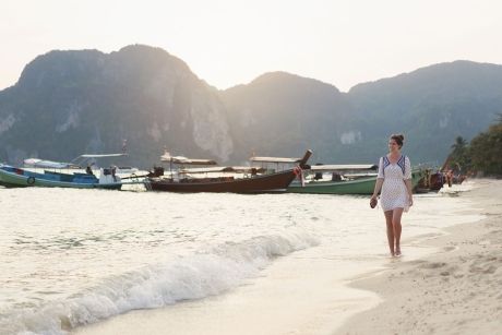 English teacher walking on Thai beach