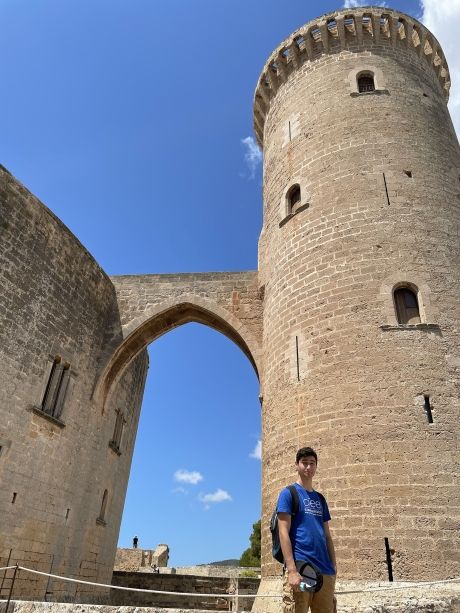 High school student posing in front of Bellver Castle in Palma de Mallorca