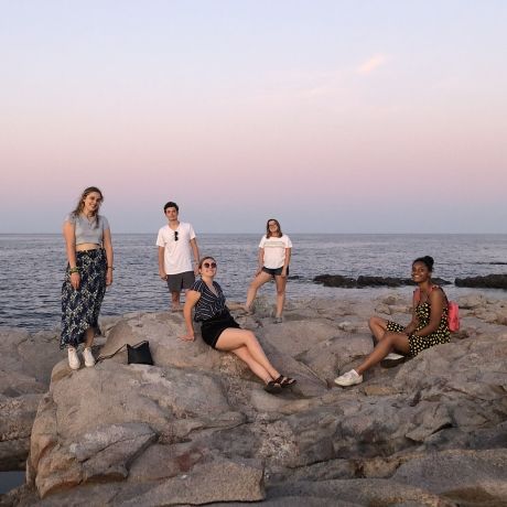 copenhagen denmark sunset students on rocks