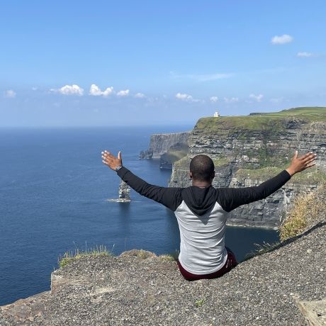 student on cliff ireland abroad