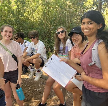 High school student holding a clipboard