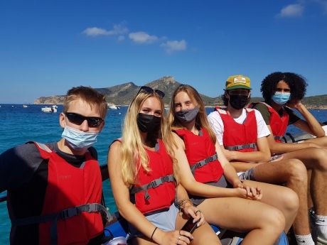 High school students on boat in Palma de Mallorca wearing life jackets