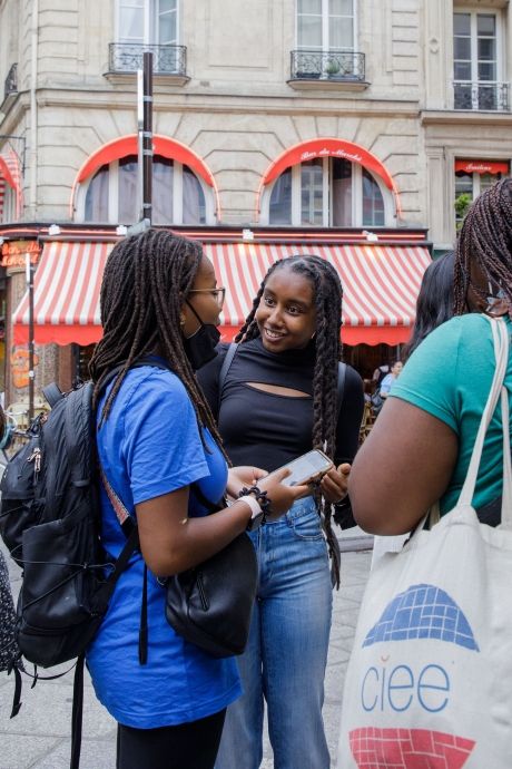 High school summer abroad students talking in the street