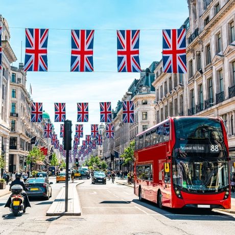 London street with flags and bus