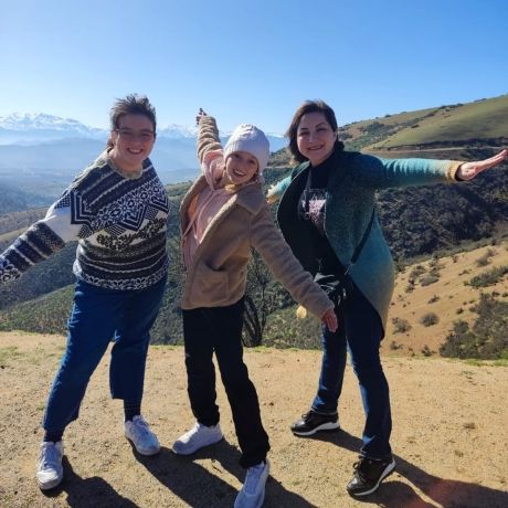 host student with family on cliff chile