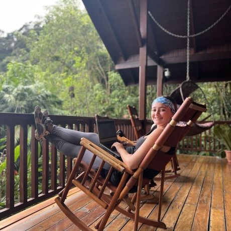 study abroad student in hammock porch