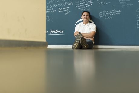 Student leaning against chalkboard in Seville