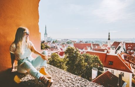 Tallinn girl overlooking city skyline