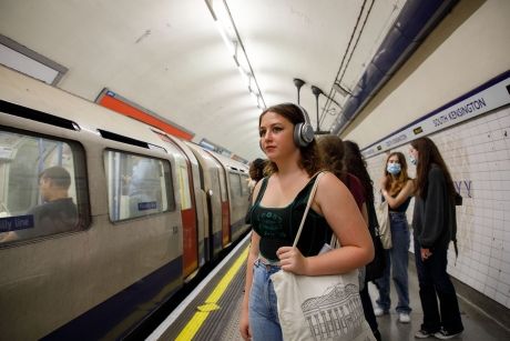 High school student waiting for the Tube in London