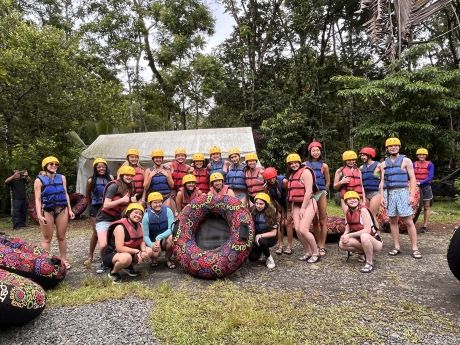 Group of high school students posing before tubing on the Rio Celeste in Monteverde
