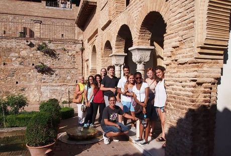 High school group posing under arch in Granada