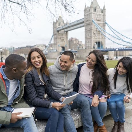 London laughing students at Tower Bridge