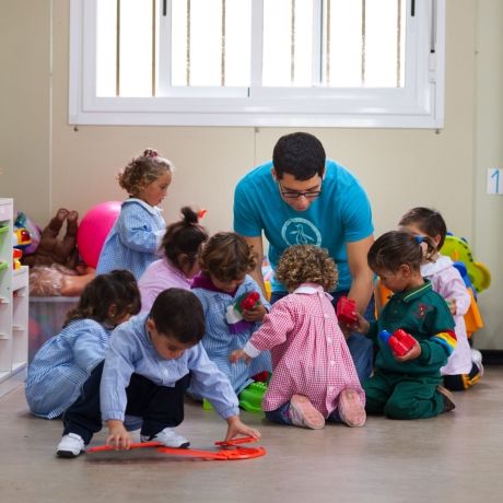 Seville student working with toddlers
