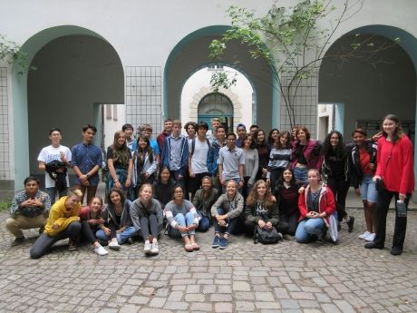 Group photo of high school students under arches in Berlin