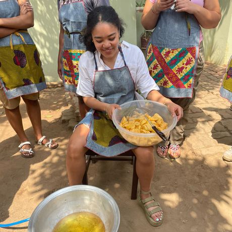 Legon student frying plantains
