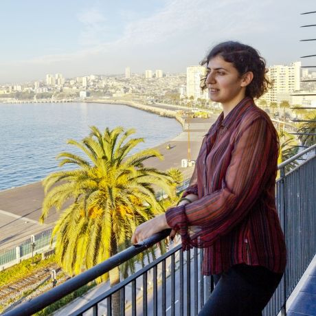 santiago ch student intern on balcony overlooking water