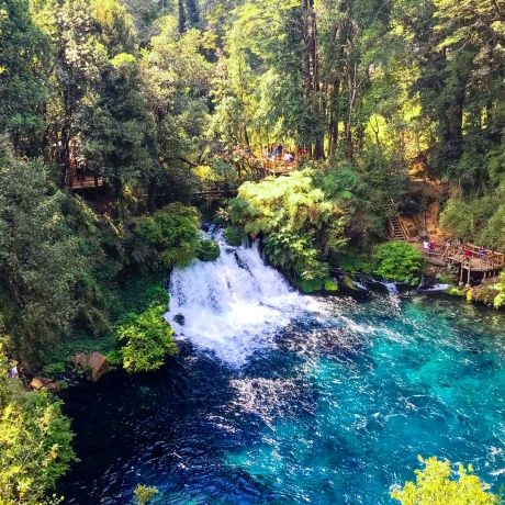 santiago ch waterfall flowing into blue lake