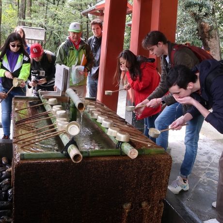 tokyo students drinking water at shrine