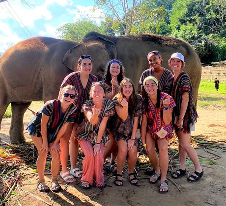 Group selfie at an elephant sanctuary in Thailand