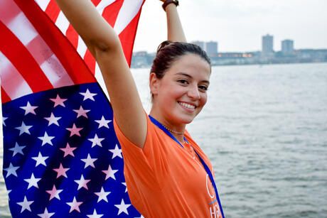 hsusa student holding american flag in NYC harbor