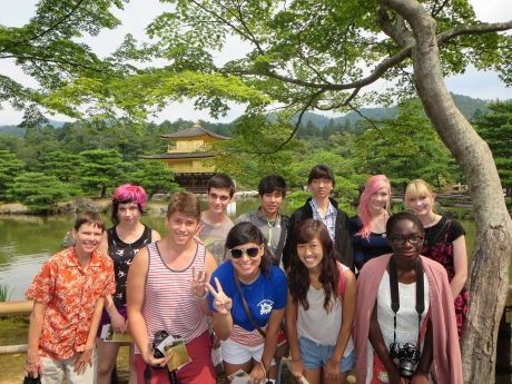 Tokyo_participants under tree in front of river_lake and Japanese temple.jpg