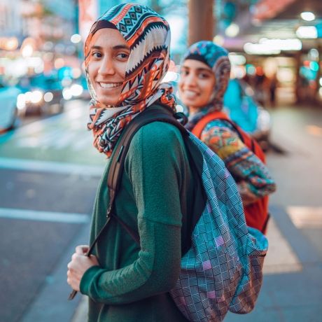 auckland girls with backpacks in the street