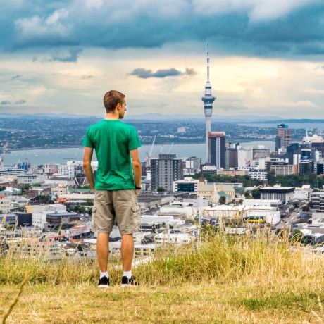 auckland man overlooking sky tower