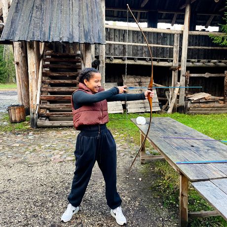 tallinn-girl-medieval-bow-village