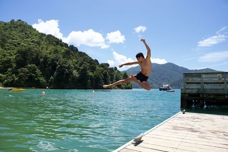 auckland-new-zealand-pax-jumping-into-water.jpg