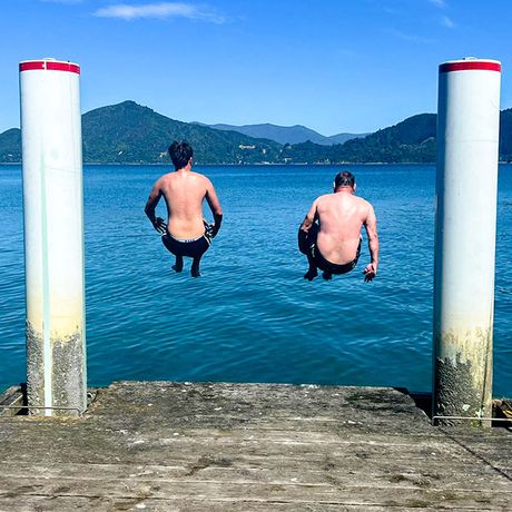 melbourne-two-guys-jumping-off-dock