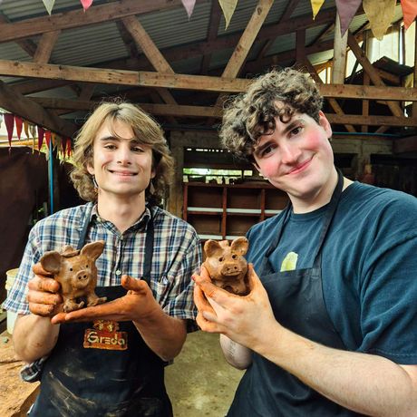 santiago-ch-two-students-holding-pottery