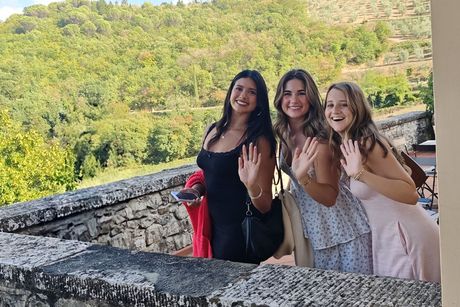 women-waving-overlook-trees