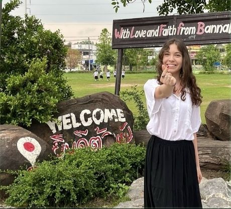 Woman-standing-with-sign