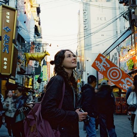 osaka-woman-with-camera-busy-street