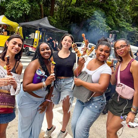 sao-paulo-five-female-students-holding-kebabs-avenida-paulista