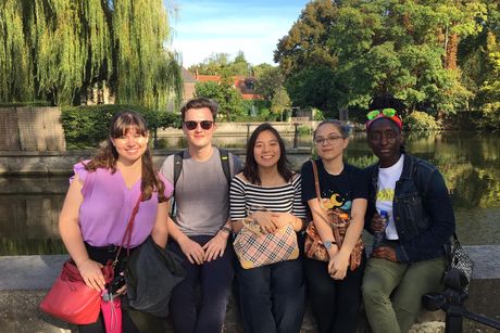 CIEE students sitting by lake in Brussels, Belgium