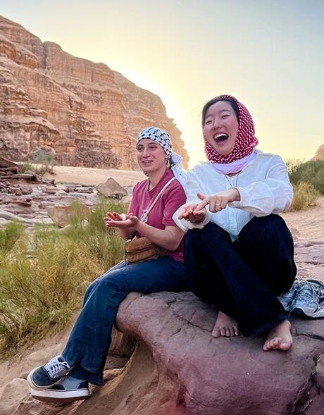 amman-two-female-students-laughing-wadi-rum-desert-sunset