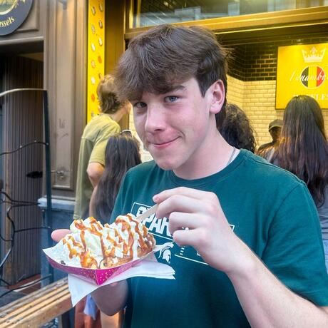 brussels-meals-student-enjoying-belgian-street-waffle