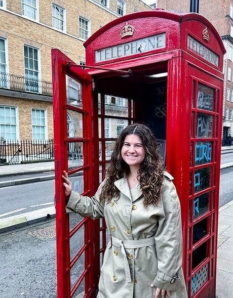 london-female-student-posing-phone-booth