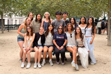 hssa-paris-students-sit-with-their-program-leader-in-a-park-on-ile-de-la-cite-module-2.jpeg