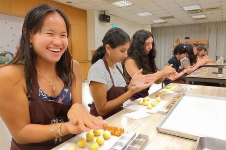 hssa-taipei-student-smiles-while-making-pineapple-cakes-during-a-baking-class-activity.jpg