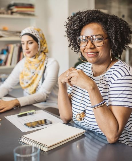 Intern women working at desk