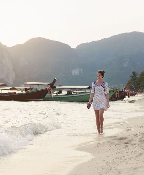 English teacher walking on Thai beach
