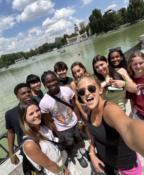 Program leaders and students posing by lake in Mardid