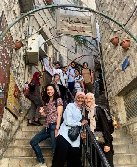 amman students standing on one of the oldest staircases in the city