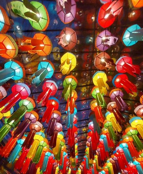 singapore looking up at lanterns hanging from ceiling