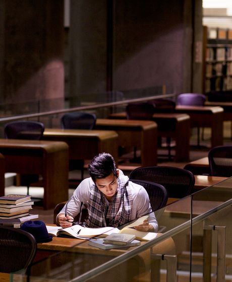 college student studying in a library